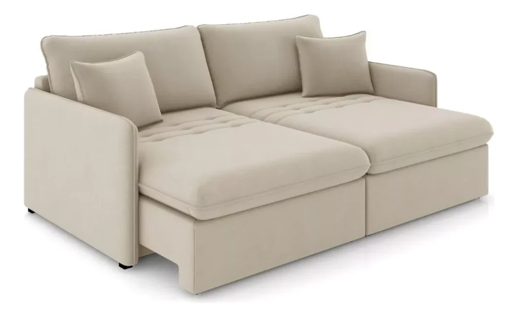 Sofá Cama aconchegante na cor bege com almofadas macias e duas almofadas decorativas, com design moderno e textura de tecido macio. Destacando-se entre os melhores sofás do mercado.